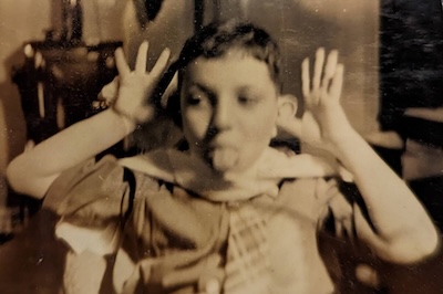 Arnold Faden as a youngster, sticking out his tongue.