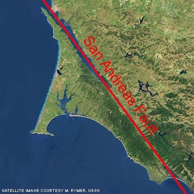 A satellite image showing the path of San Andreas fault superimposed over a Tomales Bay. The fault runs down the middle of the bay.